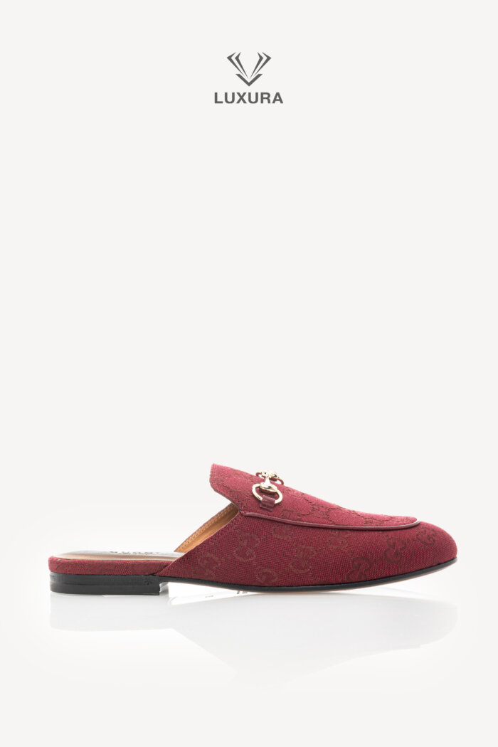 <span style="font-size: 10px;letter-spacing: .15em">BEST DEAL</span><br>            <strong>GUCCI</strong><br>            <div style="margin-top:10px;font-size:16px">GG Monogram Canvas Princetown Slippers Rosso Ancora 37</div><br>