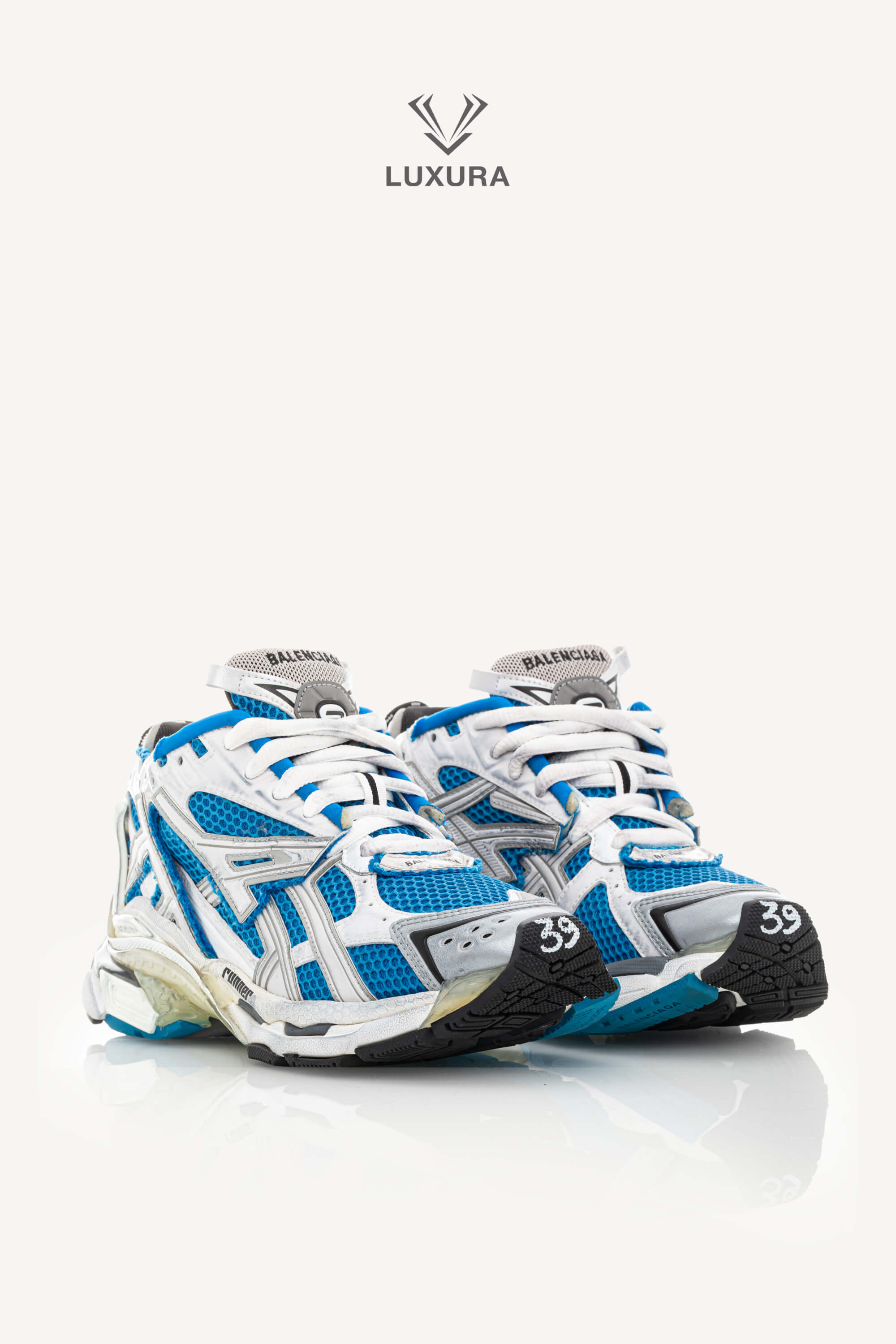 <span style="font-size: 10px;letter-spacing: .15em">BEST DEAL</span><br>            <strong>BALENCIAGA</strong><br>            <div style="margin-top:10px;font-size:16px">Mesh Rubber Bi-Color Runner Sneakers Grey Blue White 39</div><br> - Image 2