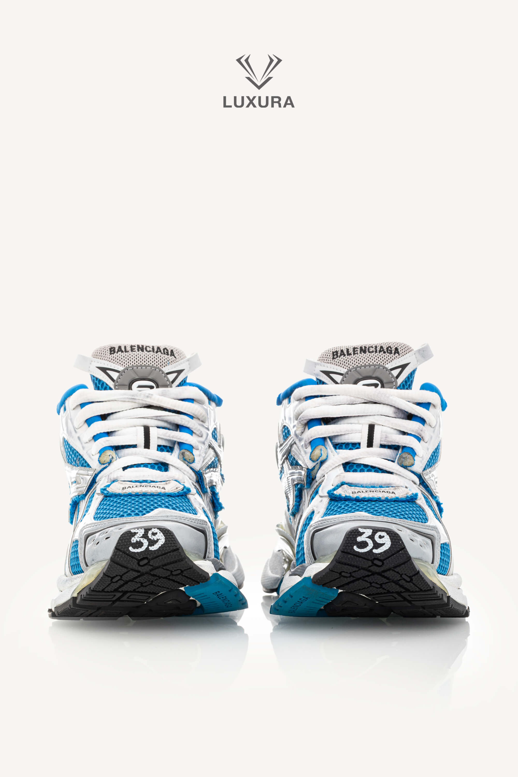 <span style="font-size: 10px;letter-spacing: .15em">BEST DEAL</span><br>            <strong>BALENCIAGA</strong><br>            <div style="margin-top:10px;font-size:16px">Mesh Rubber Bi-Color Runner Sneakers Grey Blue White 39</div><br> - Image 3