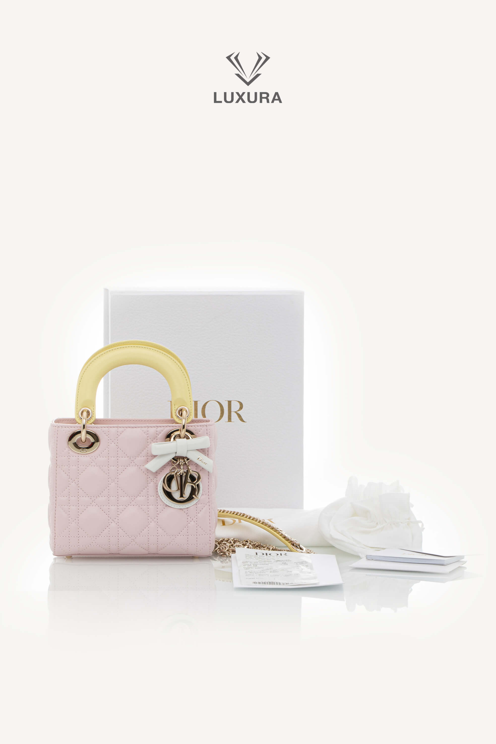 <span style="font-size: 10px;letter-spacing: .15em">NEW COLLECTION</span><br> <strong>DIOR</strong><br> <div style="margin-top:10px;font-size:16px">Lady Dior Mini Bag with Chain Lambskin Leather with Cannage Patern in Soft Pink Mimosa and White</div><br> - Image 2