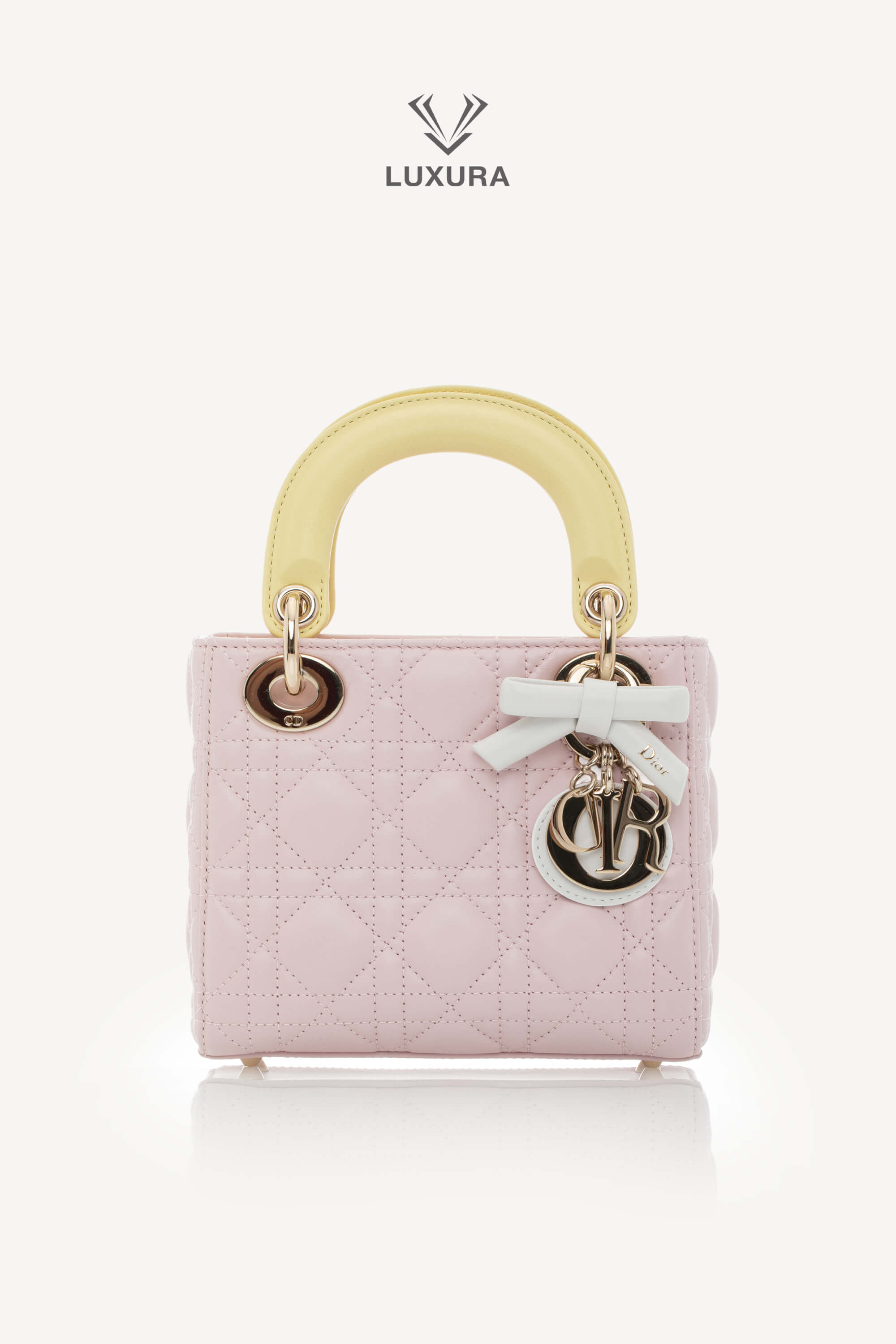 <span style="font-size: 10px;letter-spacing: .15em">NEW COLLECTION</span><br> <strong>DIOR</strong><br> <div style="margin-top:10px;font-size:16px">Lady Dior Mini Bag with Chain Lambskin Leather with Cannage Patern in Soft Pink Mimosa and White</div><br>