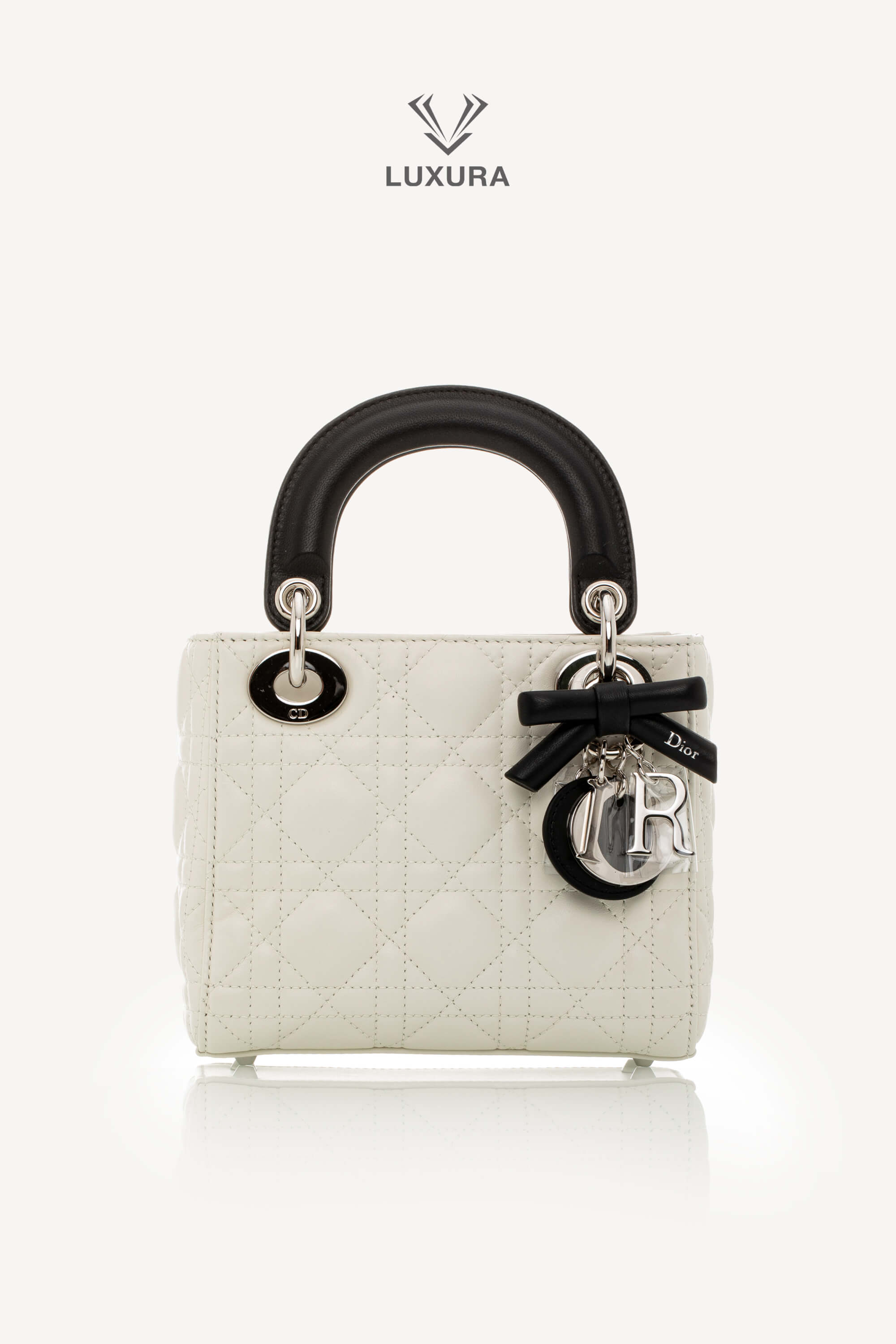 <span style="font-size: 10px;letter-spacing: .15em">NEW COLLECTION</span><br> <strong>DIOR</strong><br> <div style="margin-top:10px;font-size:16px">Mini Lady Dior Bag with Chain Two-Tone Latte and Black Cannage Lambskin</div><br>