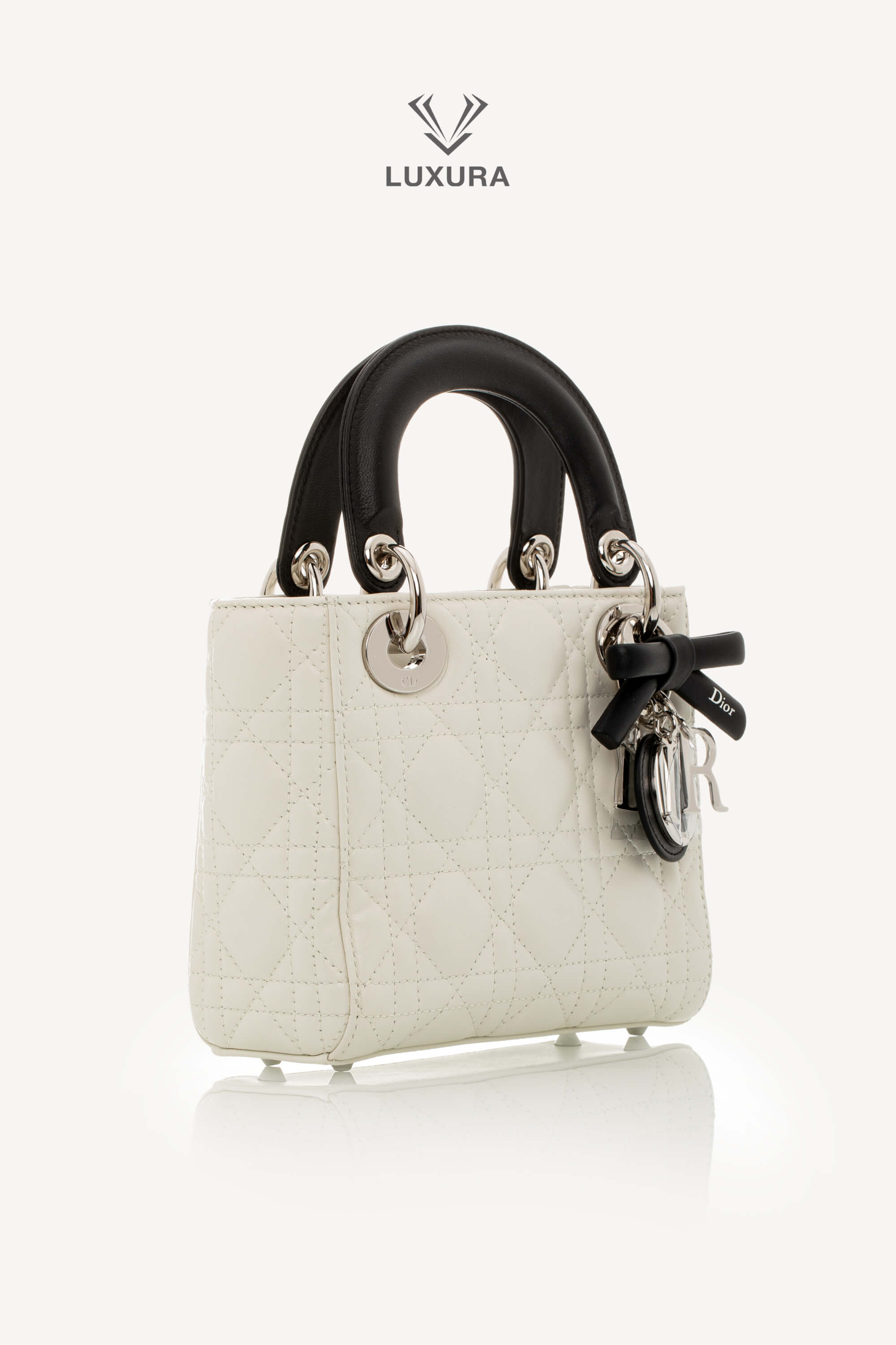 <span style="font-size: 10px;letter-spacing: .15em">NEW COLLECTION</span><br> <strong>DIOR</strong><br> <div style="margin-top:10px;font-size:16px">Mini Lady Dior Bag with Chain Two-Tone Latte and Black Cannage Lambskin</div><br> - Image 4