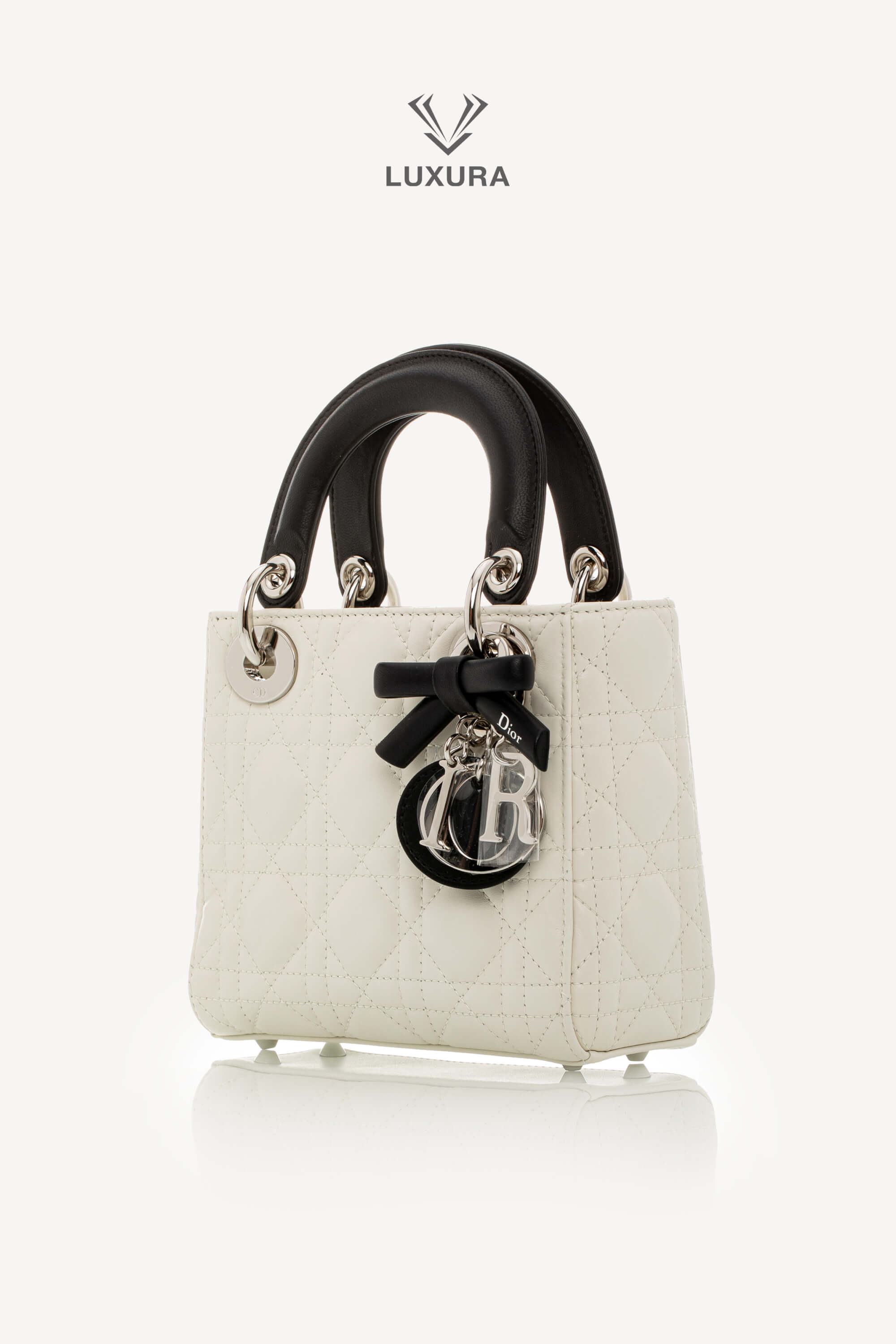 <span style="font-size: 10px;letter-spacing: .15em">NEW COLLECTION</span><br> <strong>DIOR</strong><br> <div style="margin-top:10px;font-size:16px">Mini Lady Dior Bag with Chain Two-Tone Latte and Black Cannage Lambskin</div><br> - Image 9