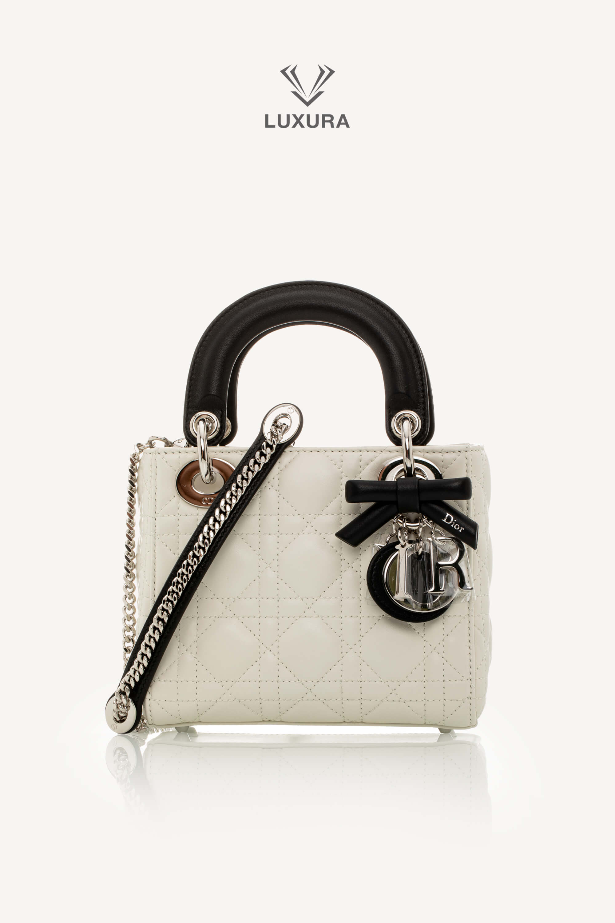<span style="font-size: 10px;letter-spacing: .15em">NEW COLLECTION</span><br> <strong>DIOR</strong><br> <div style="margin-top:10px;font-size:16px">Mini Lady Dior Bag with Chain Two-Tone Latte and Black Cannage Lambskin</div><br> - Image 6