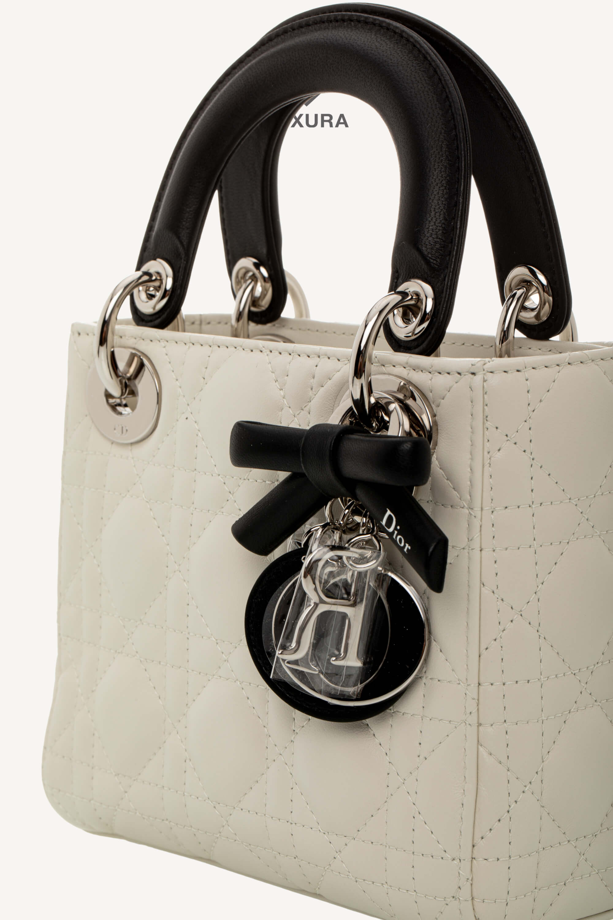 <span style="font-size: 10px;letter-spacing: .15em">NEW COLLECTION</span><br> <strong>DIOR</strong><br> <div style="margin-top:10px;font-size:16px">Mini Lady Dior Bag with Chain Two-Tone Latte and Black Cannage Lambskin</div><br> - Image 10