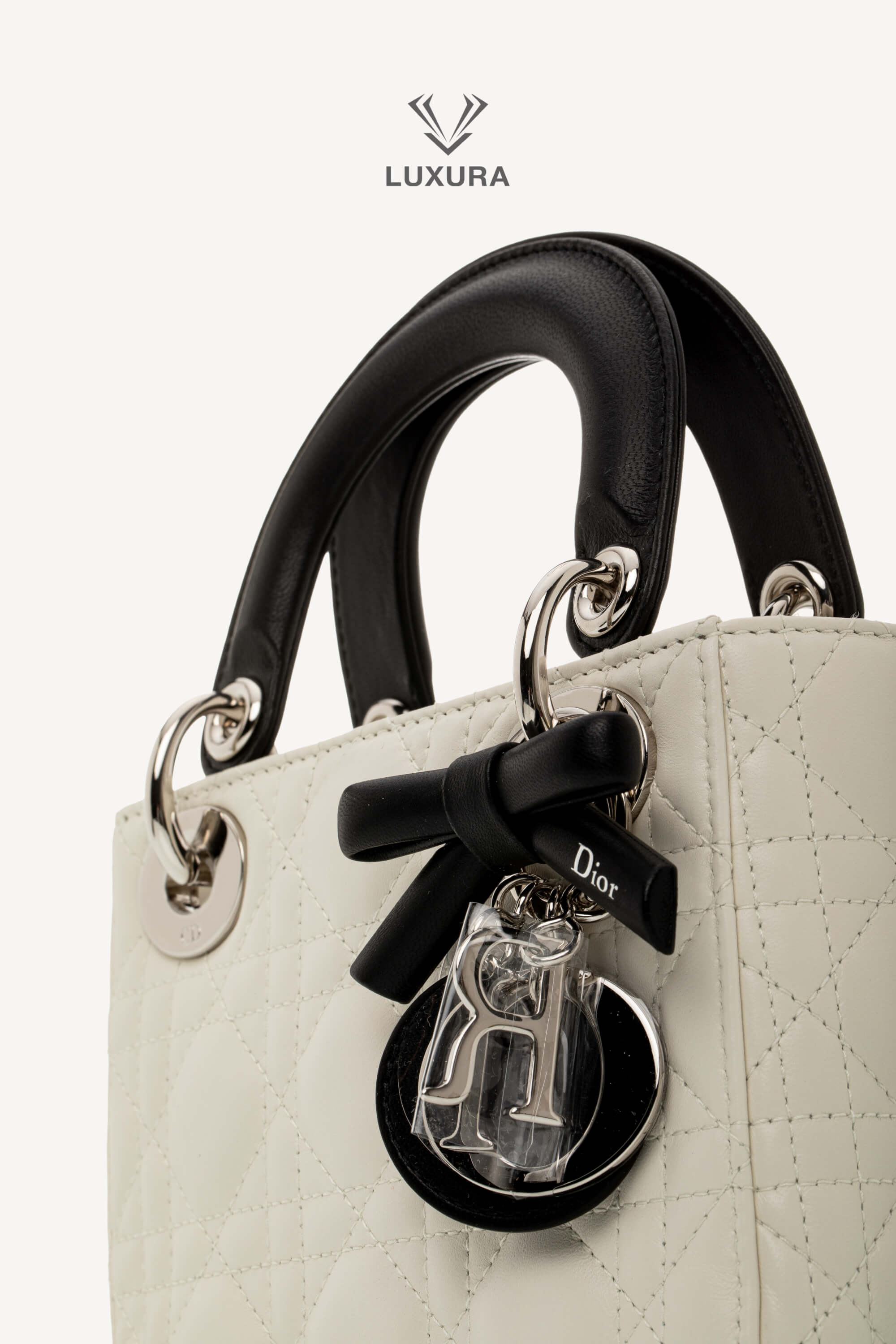 <span style="font-size: 10px;letter-spacing: .15em">NEW COLLECTION</span><br> <strong>DIOR</strong><br> <div style="margin-top:10px;font-size:16px">Mini Lady Dior Bag with Chain Two-Tone Latte and Black Cannage Lambskin</div><br> - Image 11