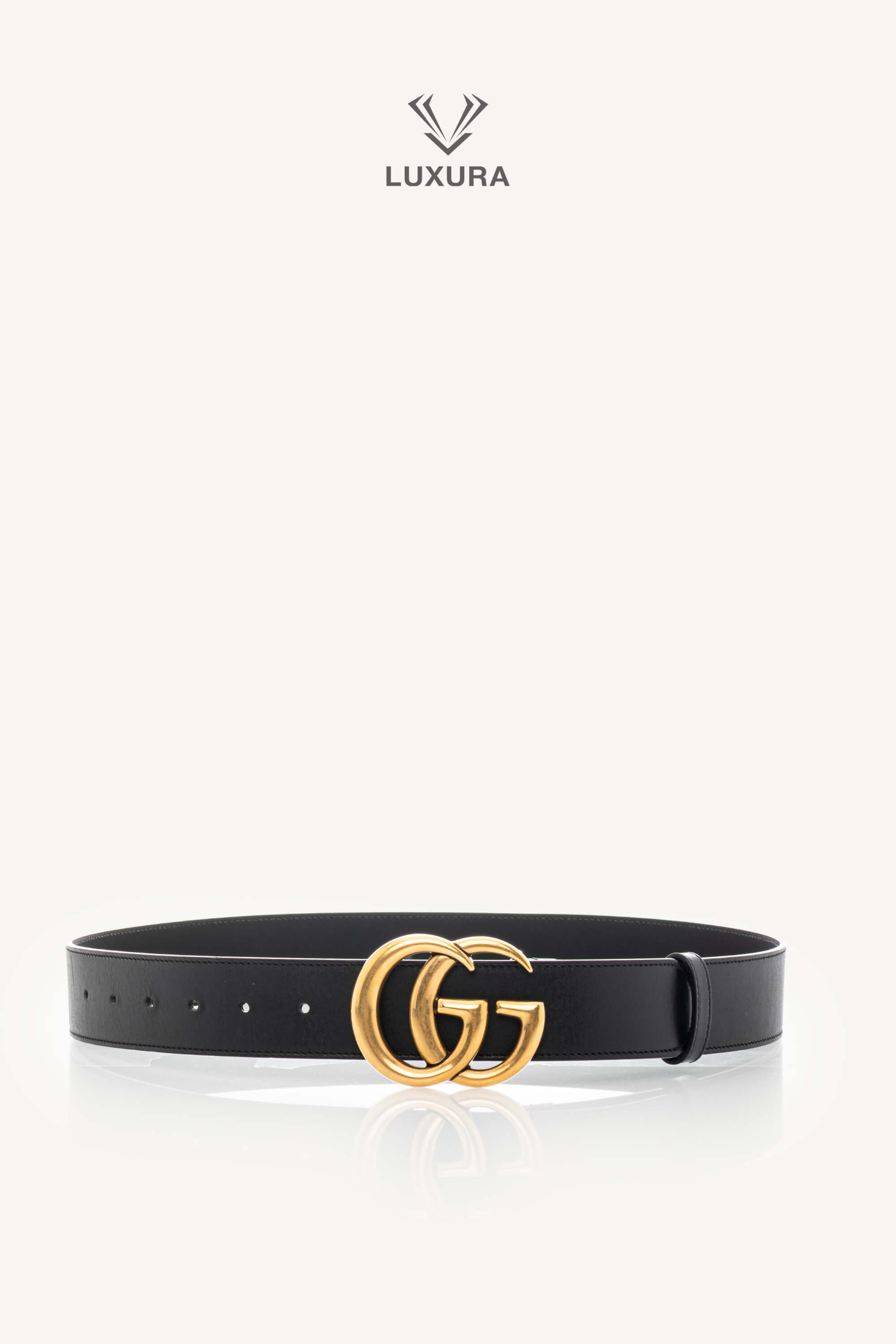 <span style="font-size: 10px;letter-spacing: .15em">IN TRENDING</span><br> <strong>GUCCI</strong><br> <div style="margin-top:10px;font-size:16px">Calfskin Double G 40mm Belt 85 Black</div><br>