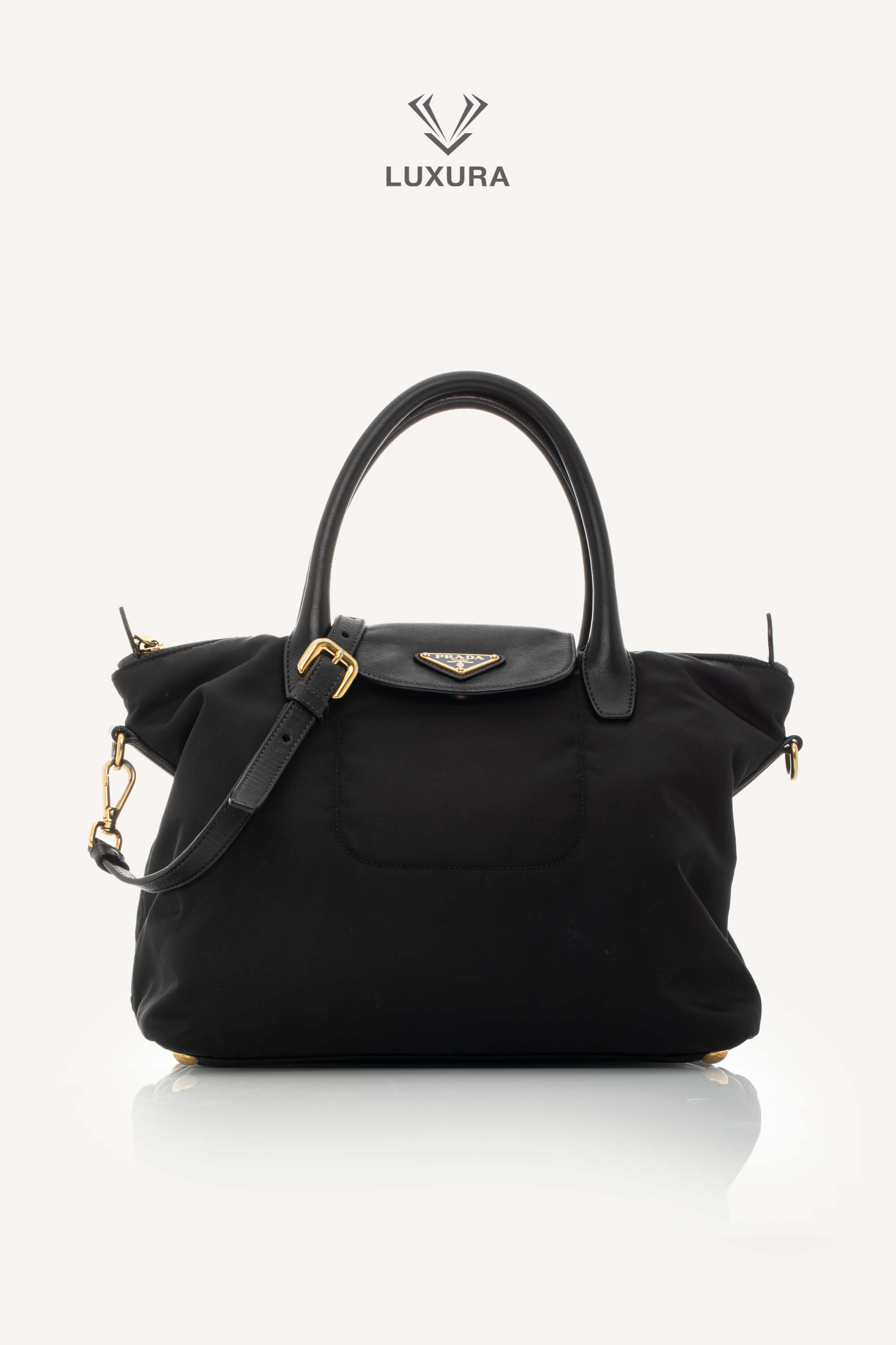 <span style="font-size: 10px;letter-spacing: .15em">BEST DEAL</span><br> <strong>PRADA</strong><br> <div style="margin-top:10px;font-size:16px">Black Nylon and Saffiano Leather Zip Satchel</div><br>