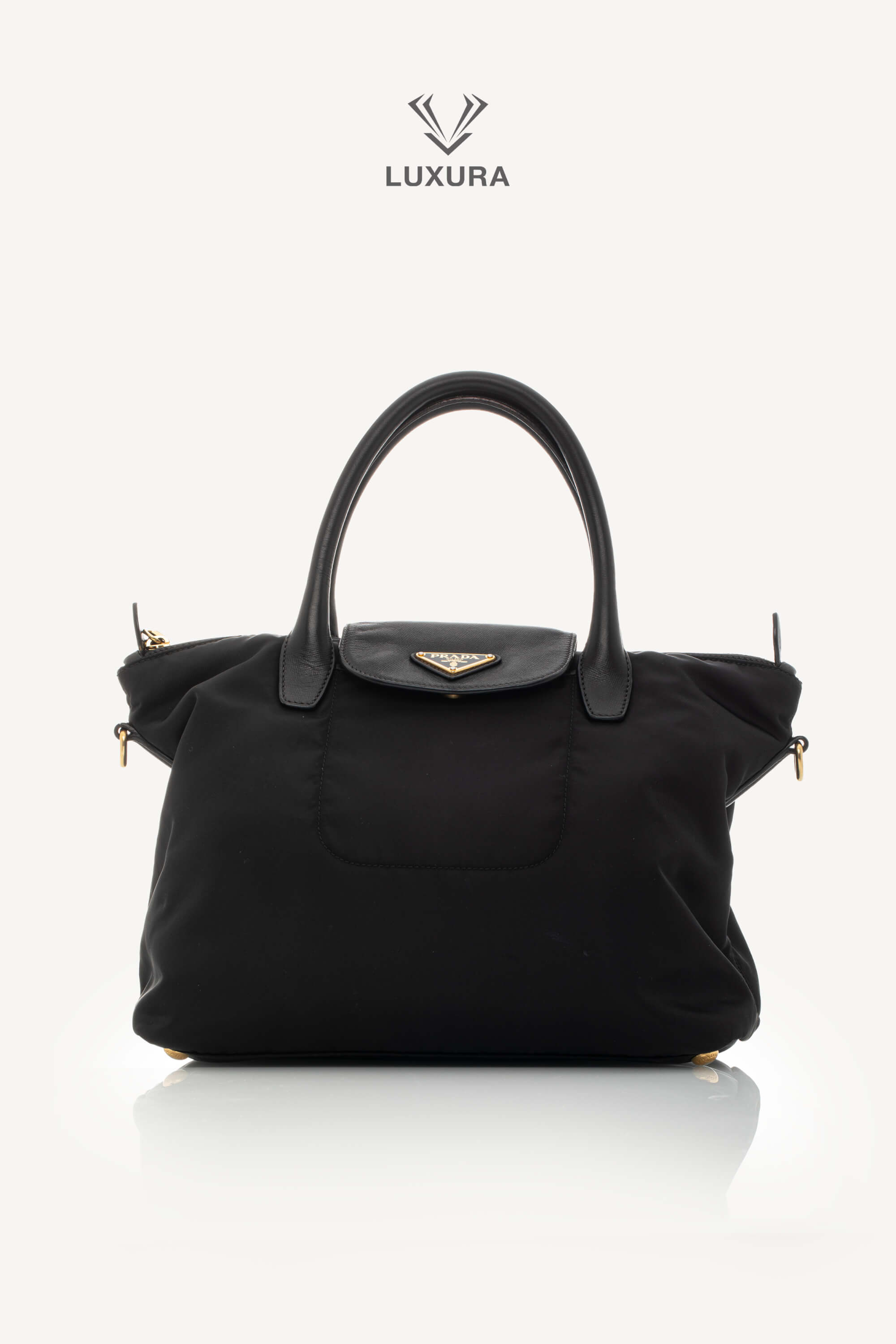 <span style="font-size: 10px;letter-spacing: .15em">BEST DEAL</span><br> <strong>PRADA</strong><br> <div style="margin-top:10px;font-size:16px">Black Nylon and Saffiano Leather Zip Satchel</div><br> - Image 2