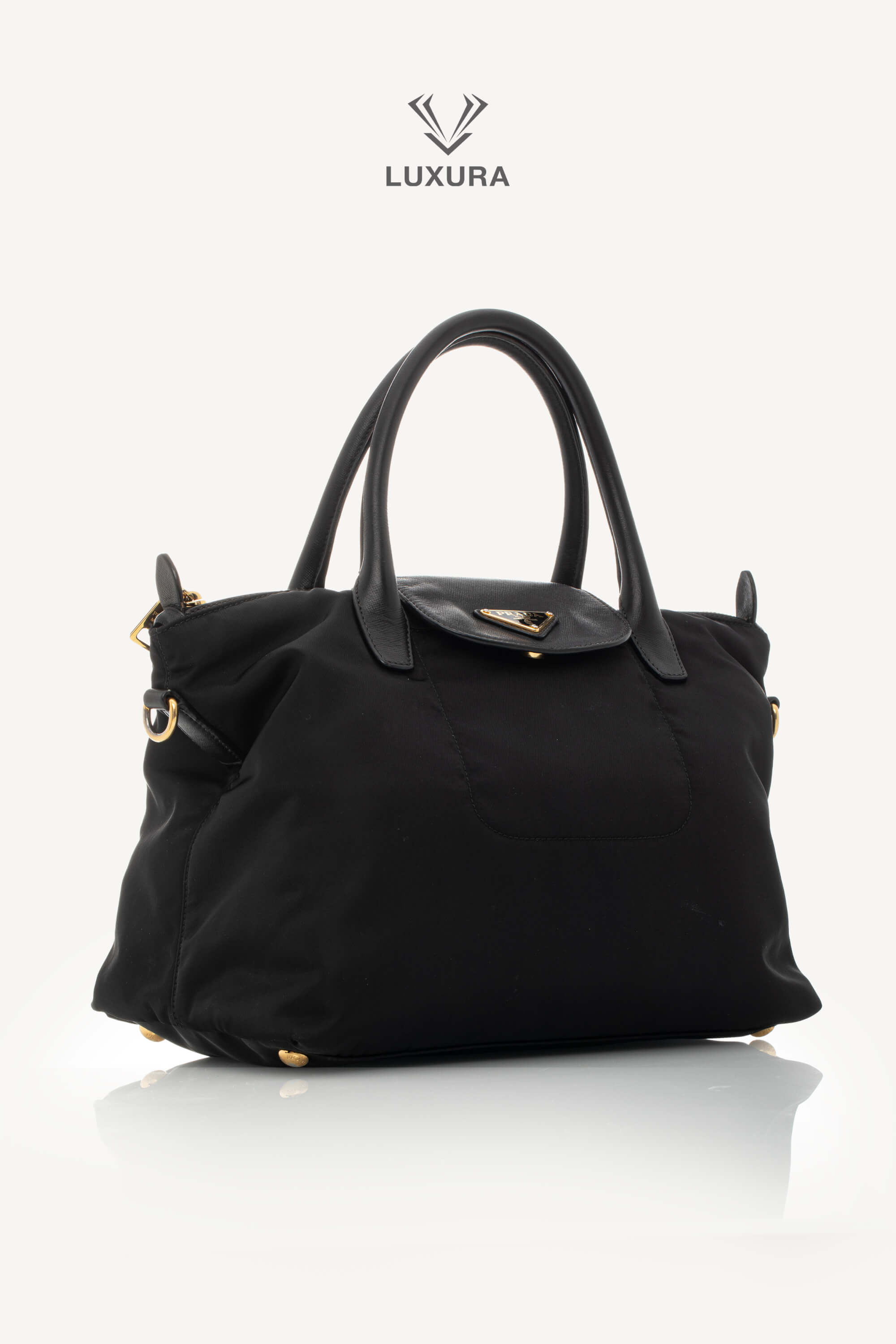 <span style="font-size: 10px;letter-spacing: .15em">BEST DEAL</span><br> <strong>PRADA</strong><br> <div style="margin-top:10px;font-size:16px">Black Nylon and Saffiano Leather Zip Satchel</div><br> - Image 3