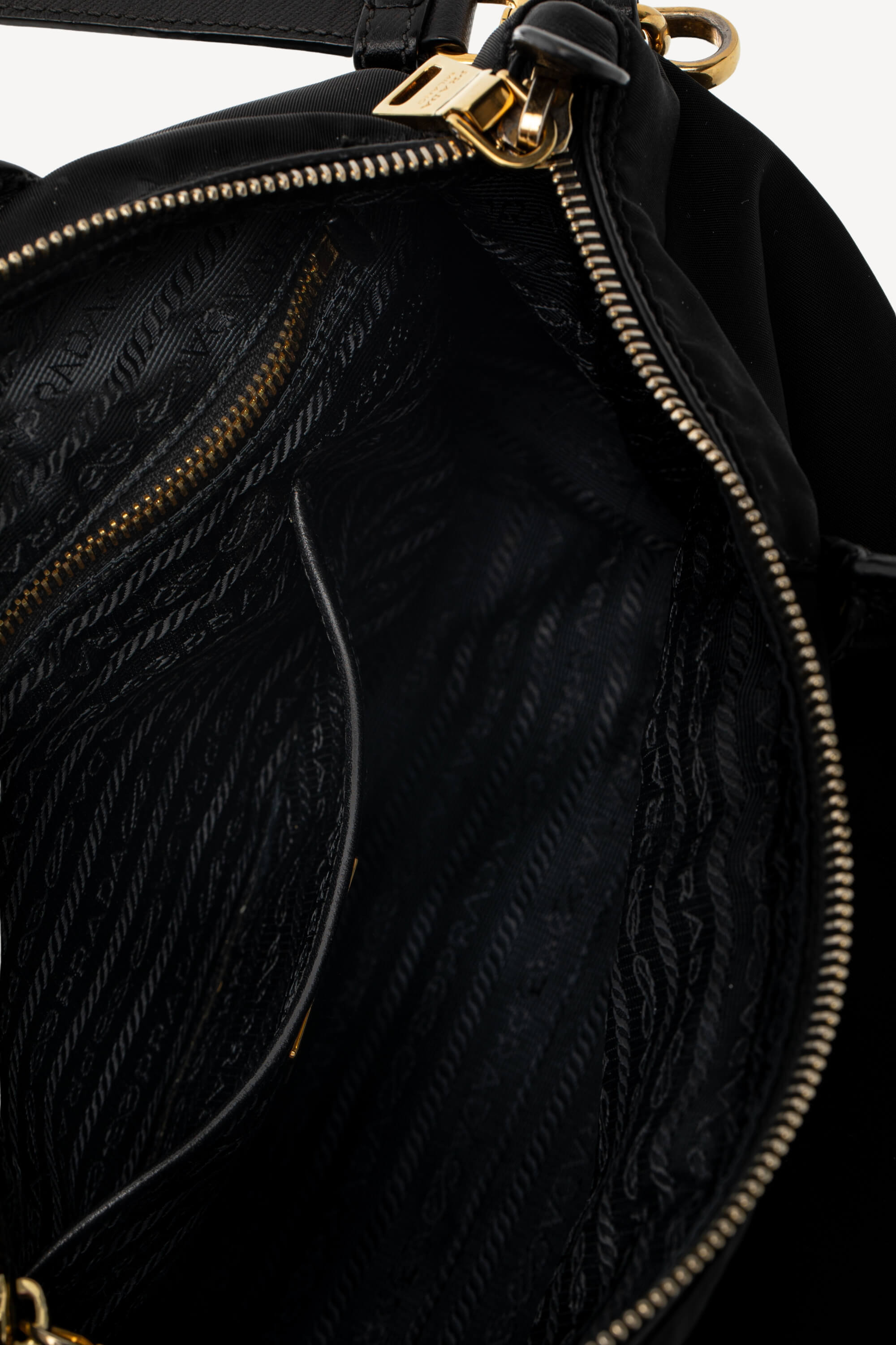 <span style="font-size: 10px;letter-spacing: .15em">BEST DEAL</span><br> <strong>PRADA</strong><br> <div style="margin-top:10px;font-size:16px">Black Nylon and Saffiano Leather Zip Satchel</div><br> - Image 11