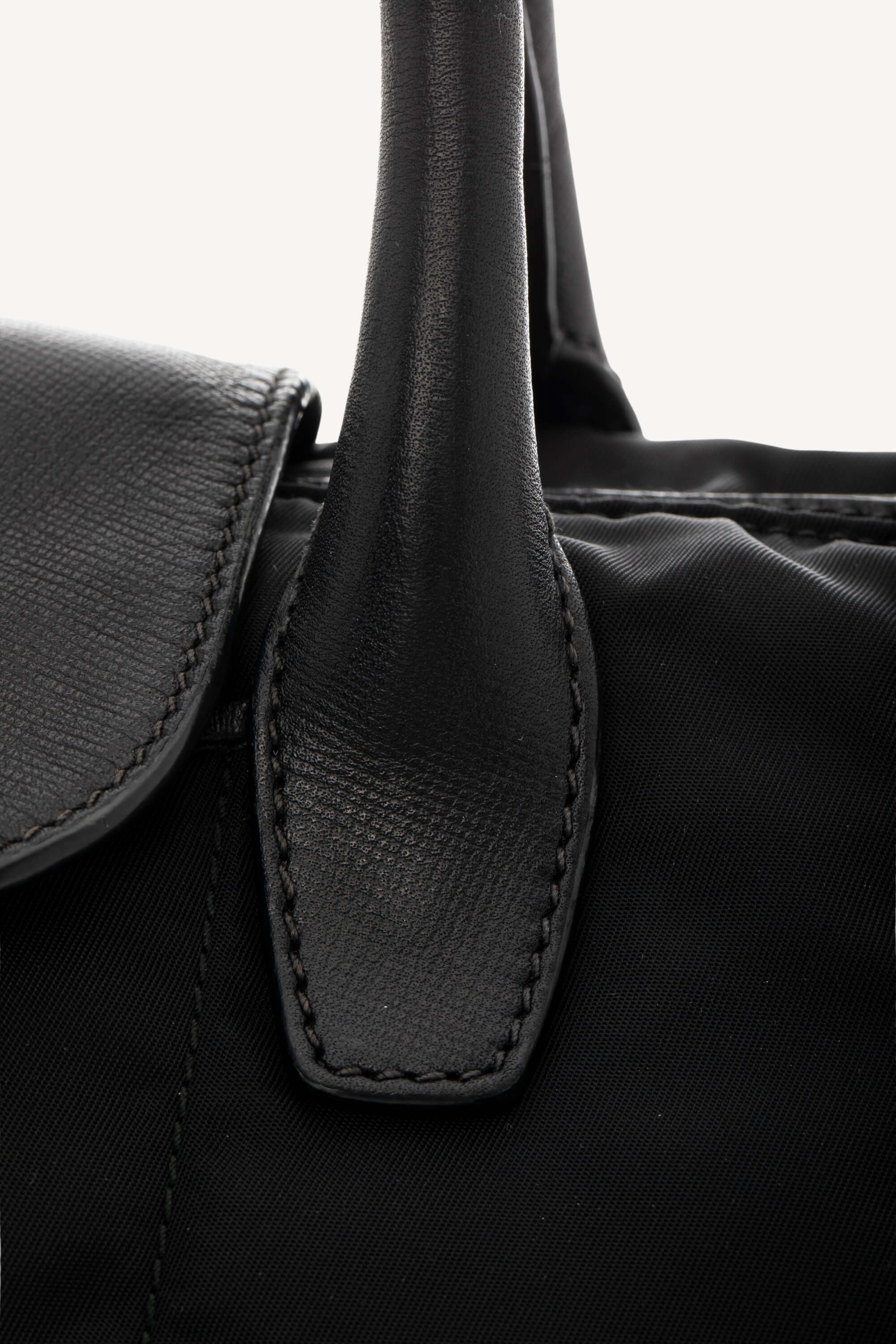 <span style="font-size: 10px;letter-spacing: .15em">BEST DEAL</span><br> <strong>PRADA</strong><br> <div style="margin-top:10px;font-size:16px">Black Nylon and Saffiano Leather Zip Satchel</div><br> - Image 10