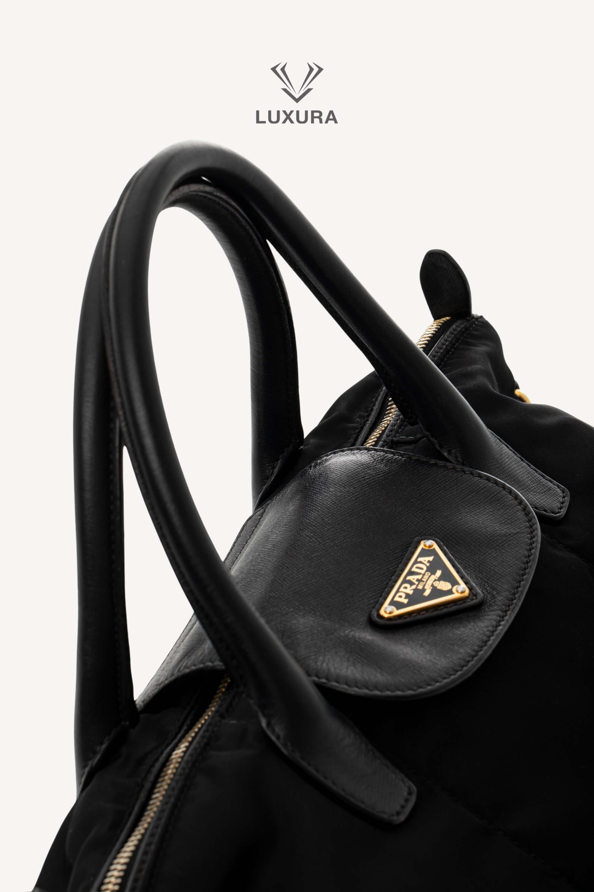 <span style="font-size: 10px;letter-spacing: .15em">BEST DEAL</span><br> <strong>PRADA</strong><br> <div style="margin-top:10px;font-size:16px">Black Nylon and Saffiano Leather Zip Satchel</div><br> - Image 9
