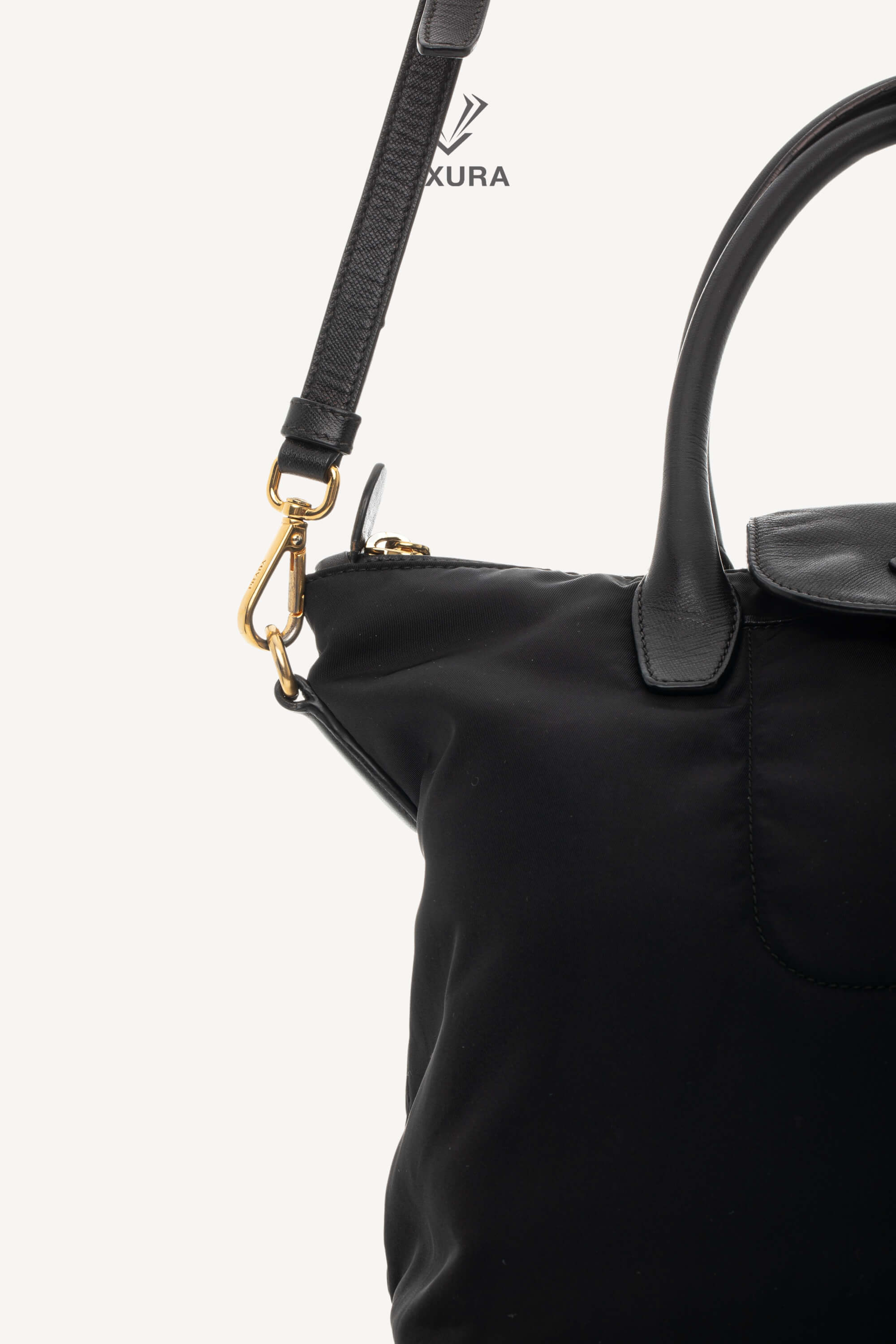 <span style="font-size: 10px;letter-spacing: .15em">BEST DEAL</span><br> <strong>PRADA</strong><br> <div style="margin-top:10px;font-size:16px">Black Nylon and Saffiano Leather Zip Satchel</div><br> - Image 14