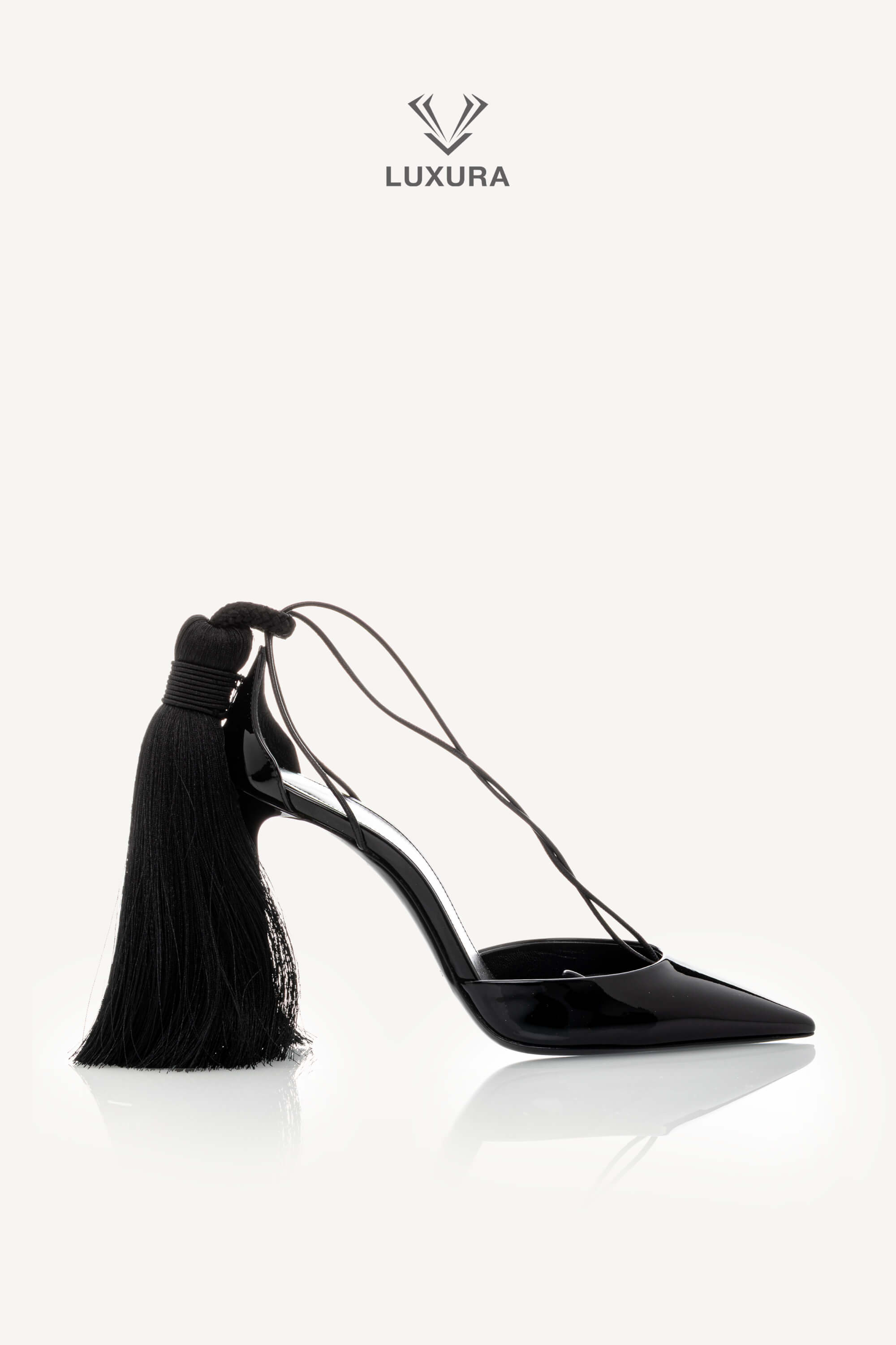 <span style="font-size: 10px;letter-spacing: .15em">HARD TO FIND</span><br>            <strong>SAINT LAURENT</strong><br>            <div style="margin-top:10px;font-size:16px">Patent Leather Zoe 105 Tassel Wrap Pumps Black 36</div><br>