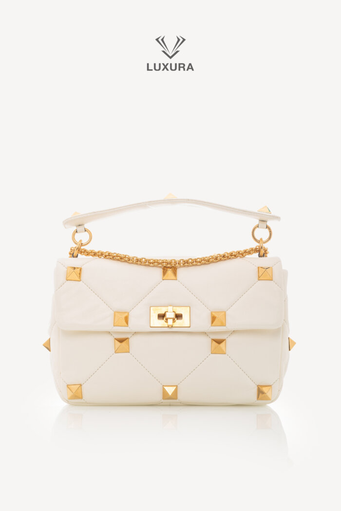 <span style="font-size: 10px;letter-spacing: .15em">BEST DEAL</span><br>            <strong>VALENTINO</strong><br>            <div style="margin-top:10px;font-size:16px">Small Roman Stud the Shoulder Bag in Nappa Ivory</div><br>