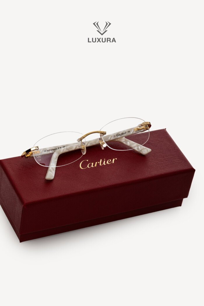 <span style="font-size: 10px;letter-spacing: .15em">BEST DEAL</span><br>            <strong>CARTIER</strong><br>            <div style="margin-top:10px;font-size:16px">CT0056O-002 Eyeglasses Rimless Shinny Gold-Pearl Chevron</div><br>