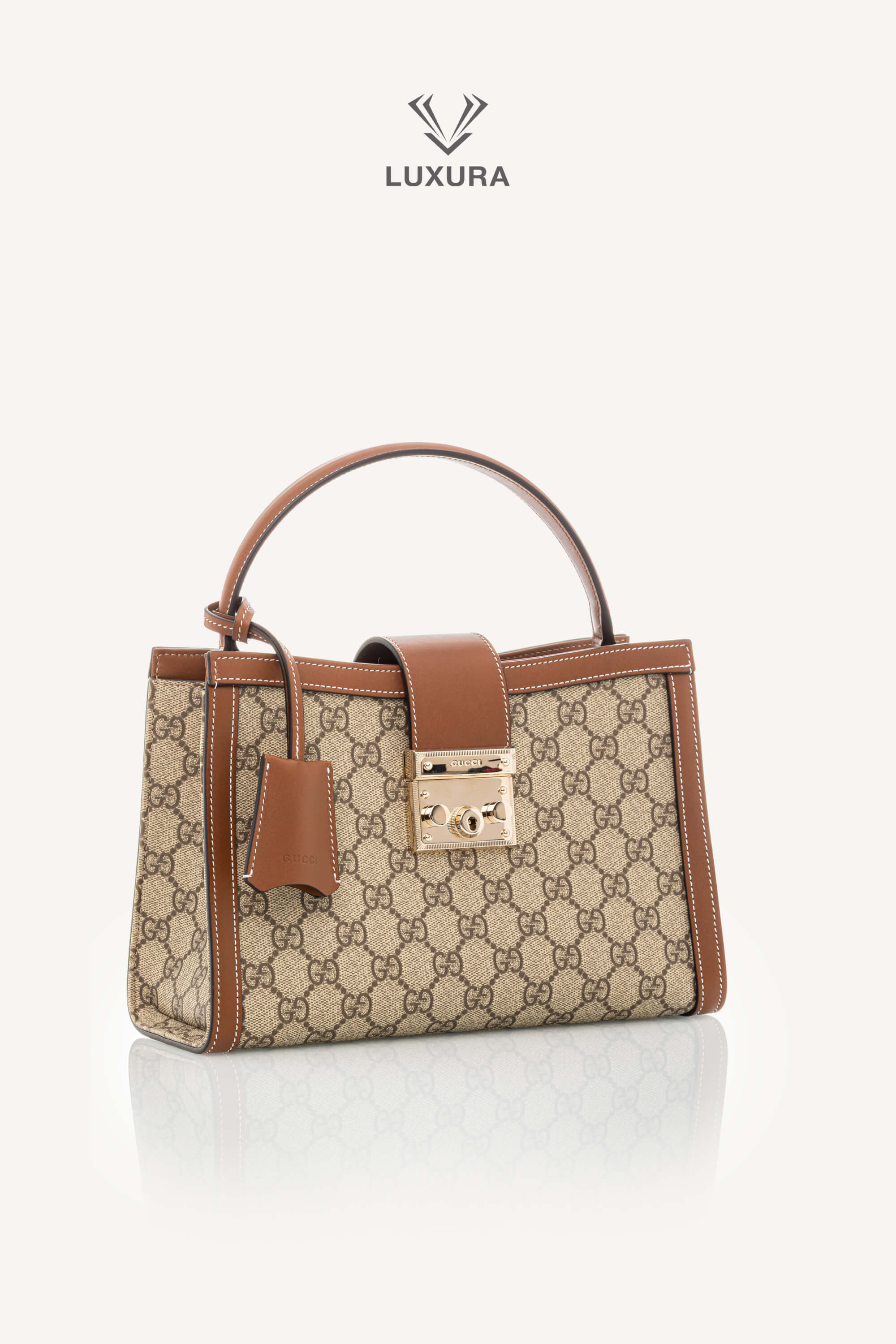 <span style="font-size: 10px;letter-spacing: .15em">NEW COLLECTION</span><br> <strong>GUCCI</strong><br> <div style="margin-top:10px;font-size:16px">Padlock Medium Top Handle Bag Beige-Brown GG Fabric</div><br> - Image 3