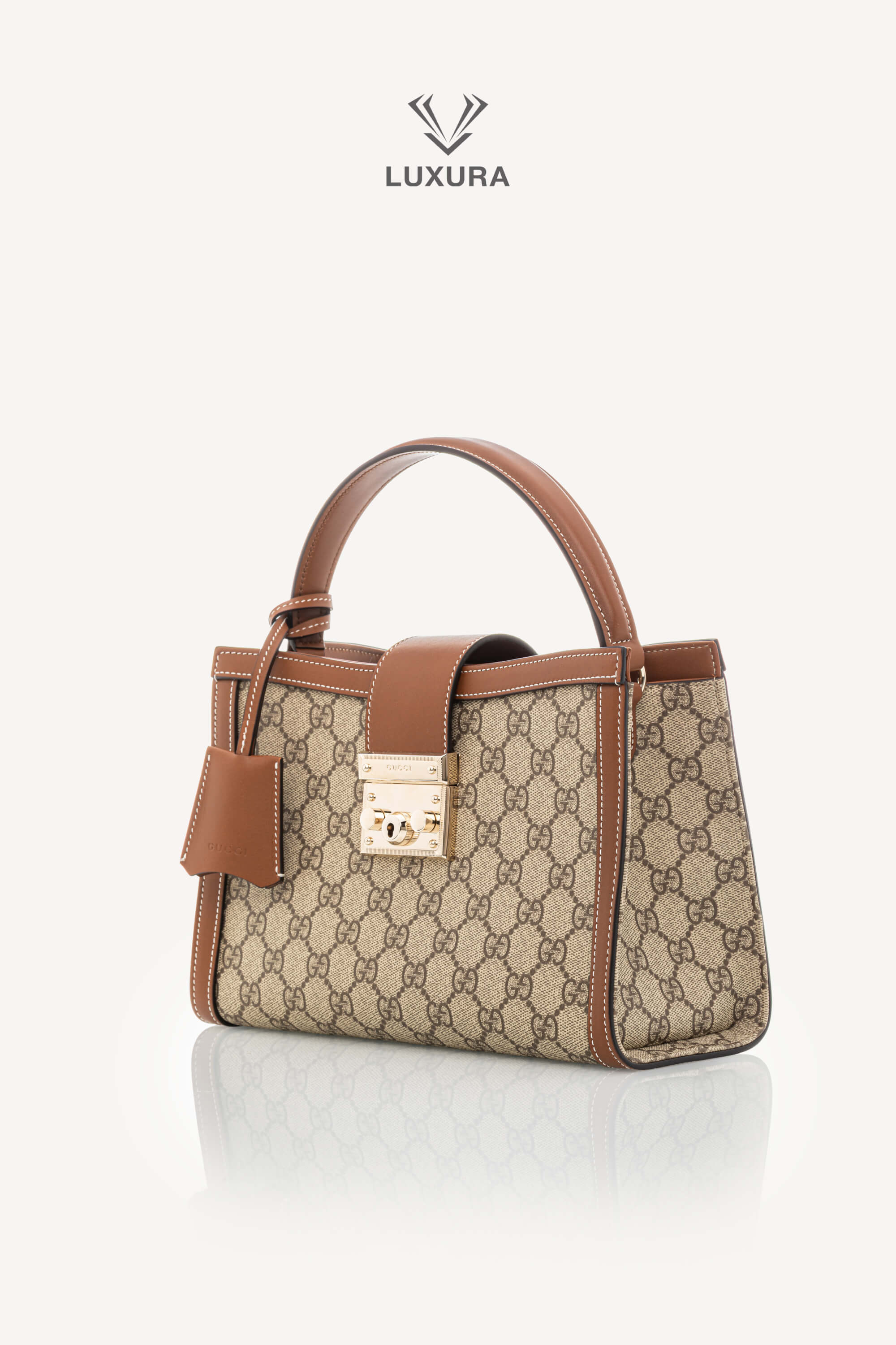 <span style="font-size: 10px;letter-spacing: .15em">NEW COLLECTION</span><br> <strong>GUCCI</strong><br> <div style="margin-top:10px;font-size:16px">Padlock Medium Top Handle Bag Beige-Brown GG Fabric</div><br> - Image 7