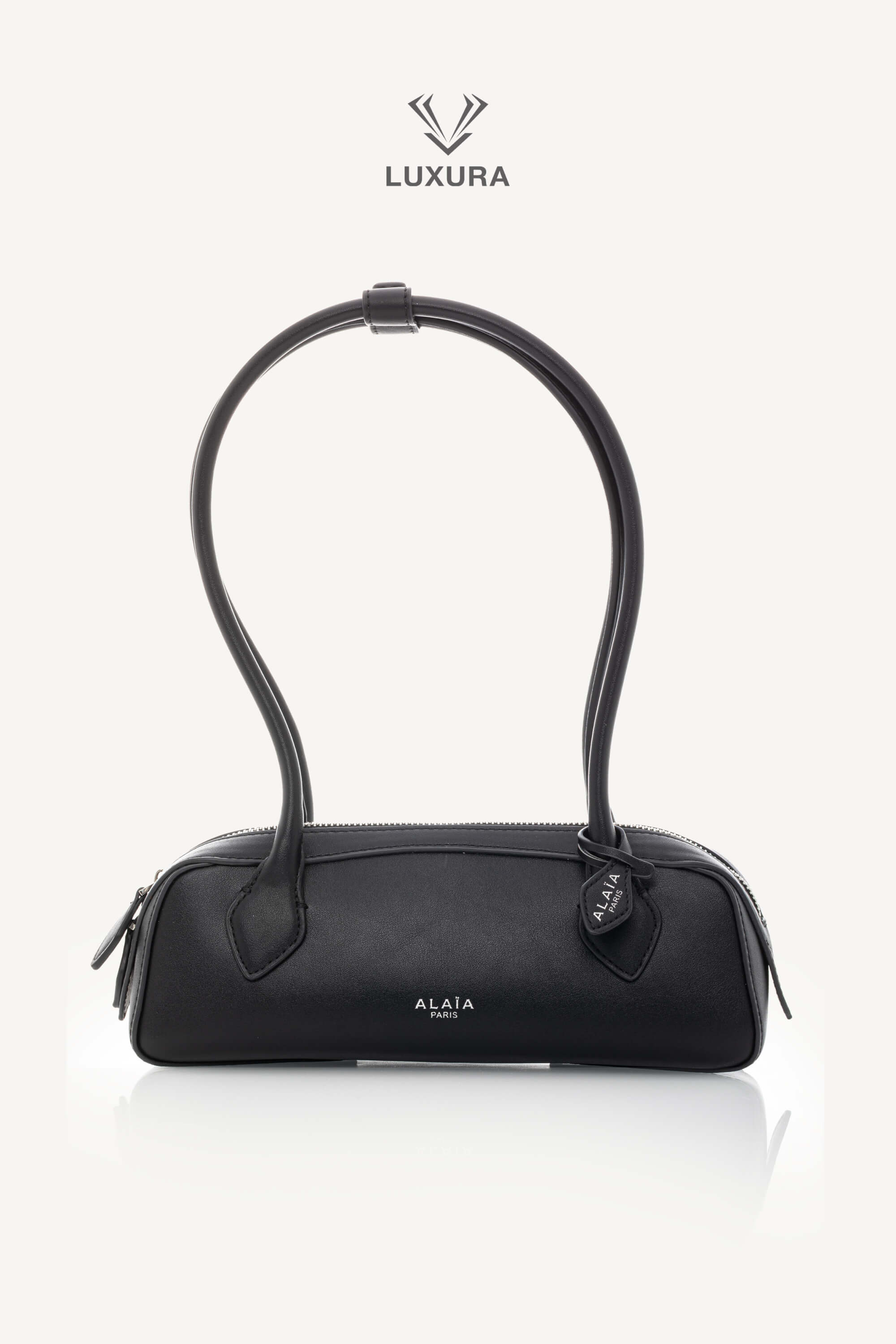 <span style="font-size: 10px;letter-spacing: .15em">HARD TO FIND</span><br> <strong>ALAIA</strong><br> <div style="margin-top:10px;font-size:16px">Goatskin Medium Le Teckel Bag Black</div><br>