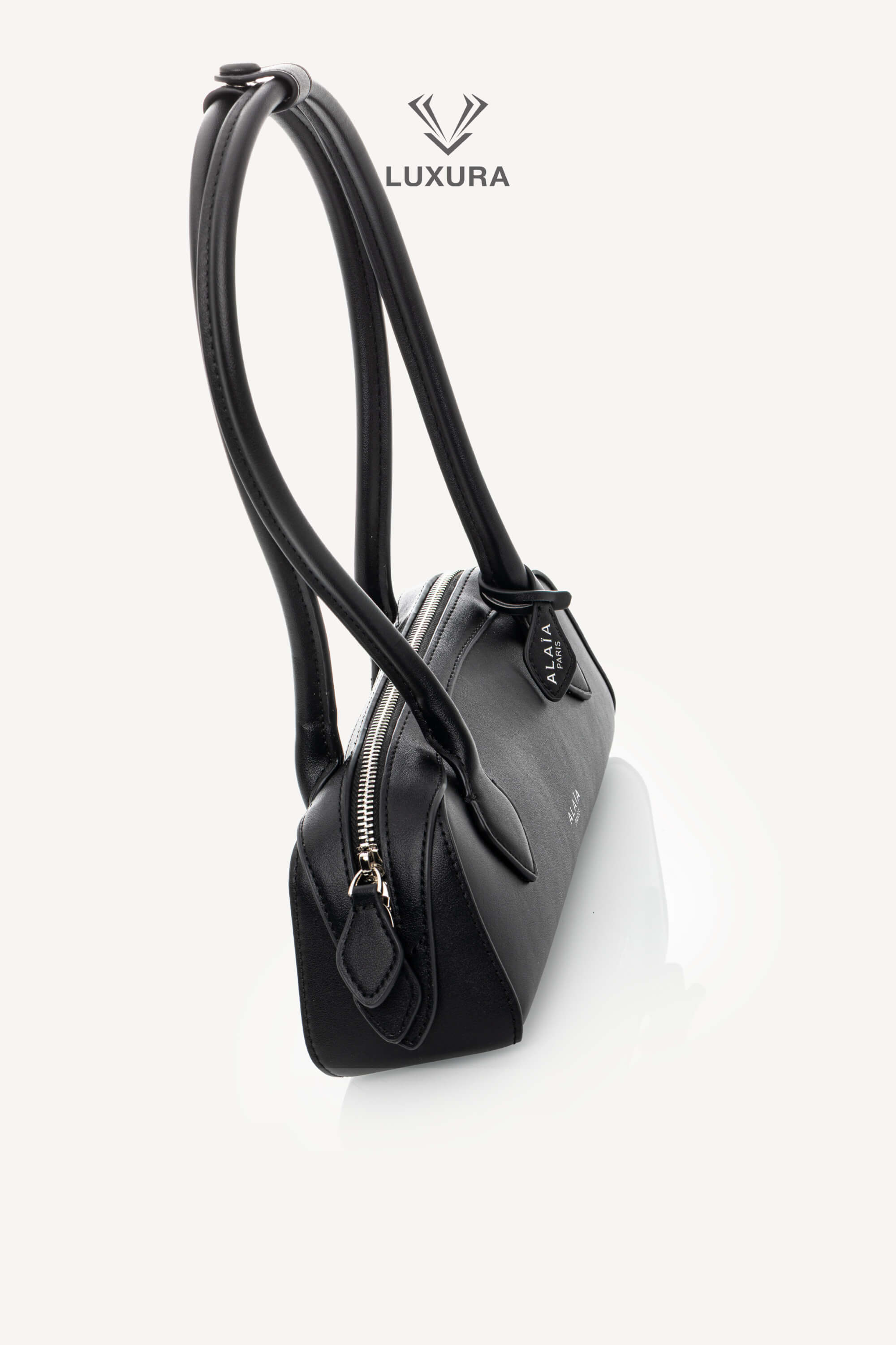 <span style="font-size: 10px;letter-spacing: .15em">HARD TO FIND</span><br> <strong>ALAIA</strong><br> <div style="margin-top:10px;font-size:16px">Goatskin Medium Le Teckel Bag Black</div><br> - Image 4